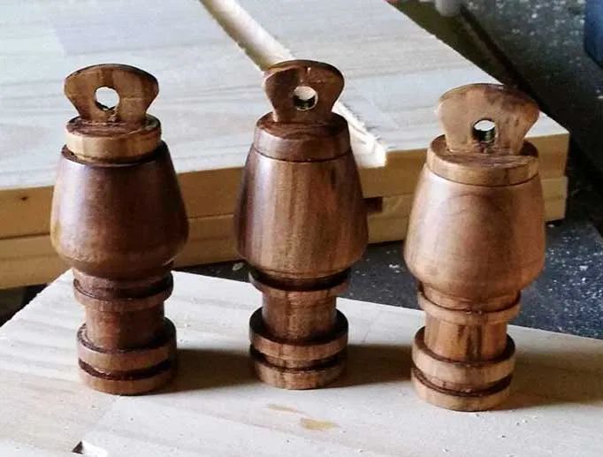 Three turned wooden waterskin spouts